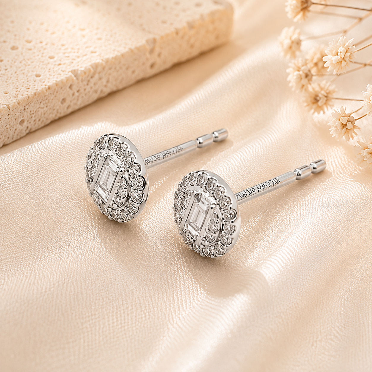 Oval diamond stud earrings angled detail view