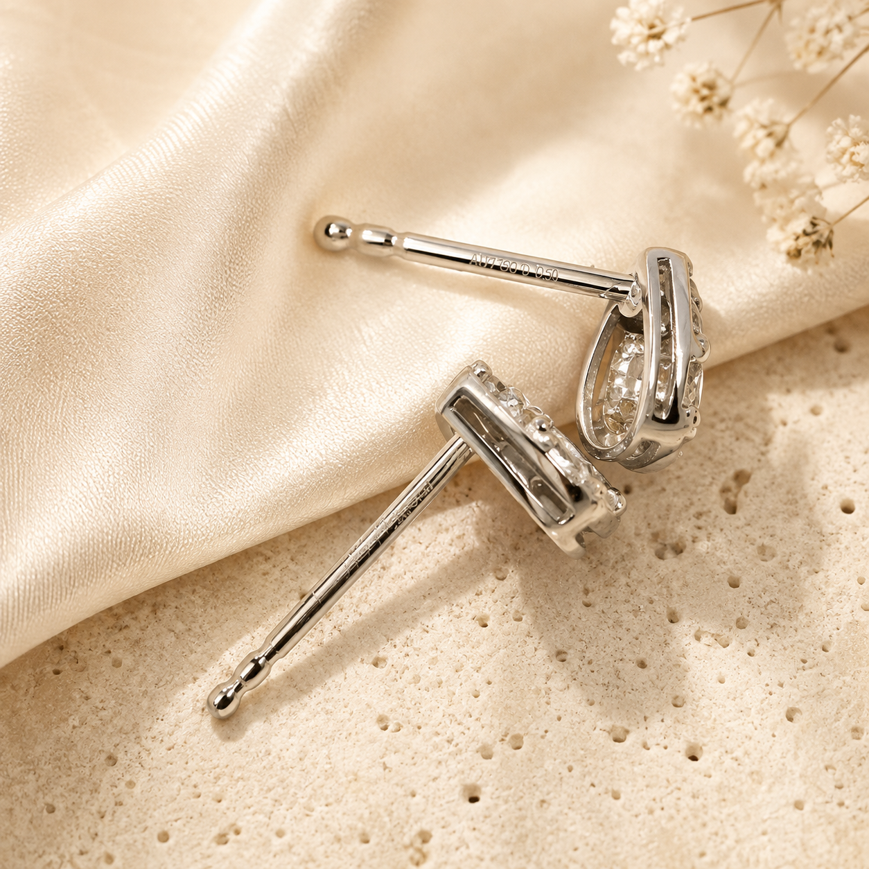 Teardrop diamond stud earrings detail view